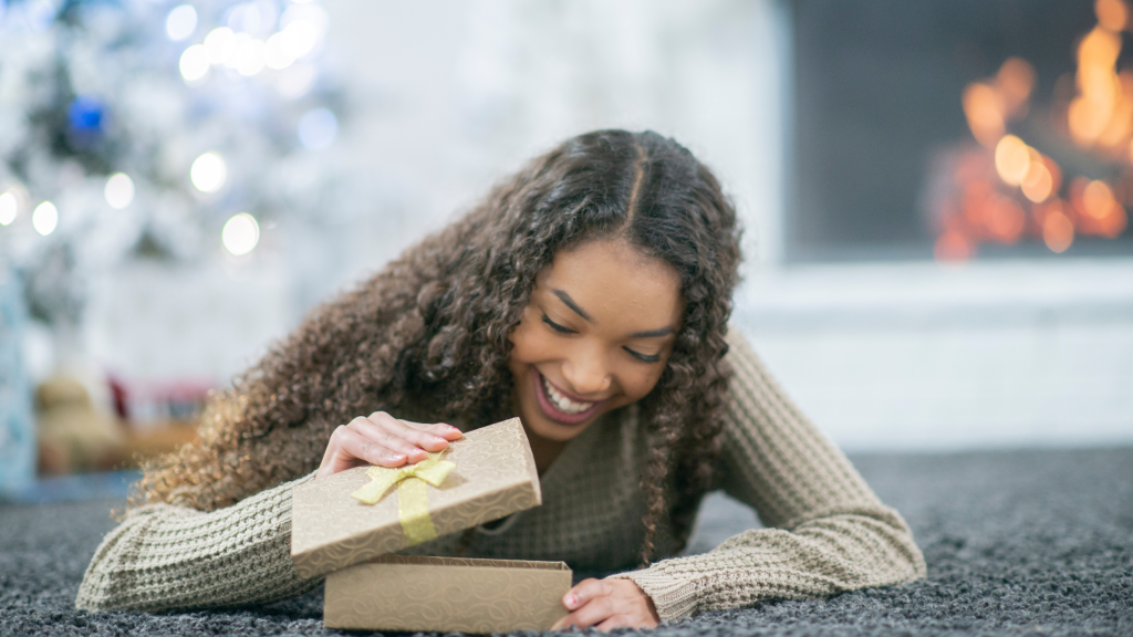 Lady opening one of the best gifts for anxiety on Amazon. 